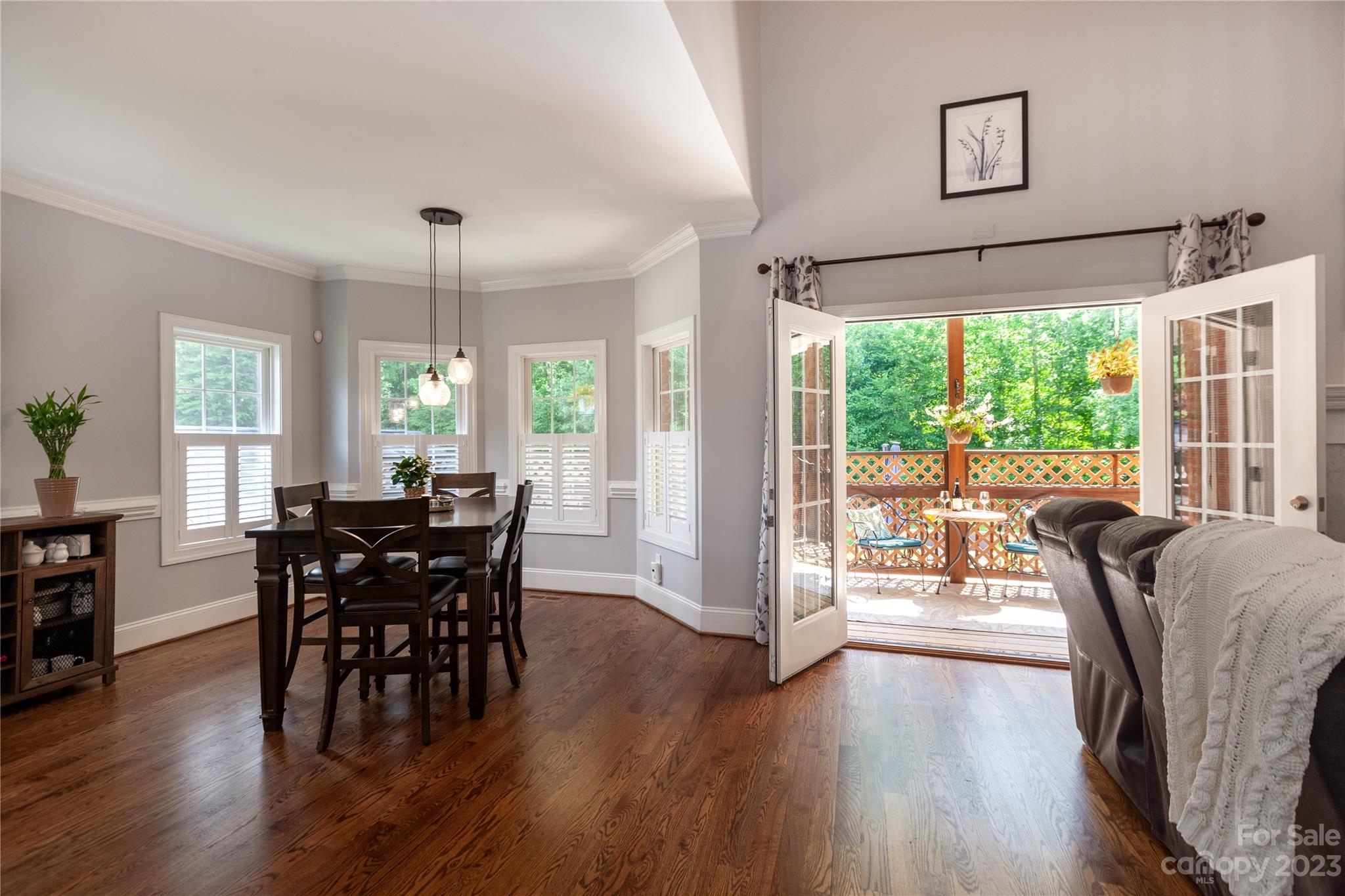 4058 Halyard Drive Denver, NC 28037 - Photo 13 of 46 a view of a dining room with furniture window and wooden floor