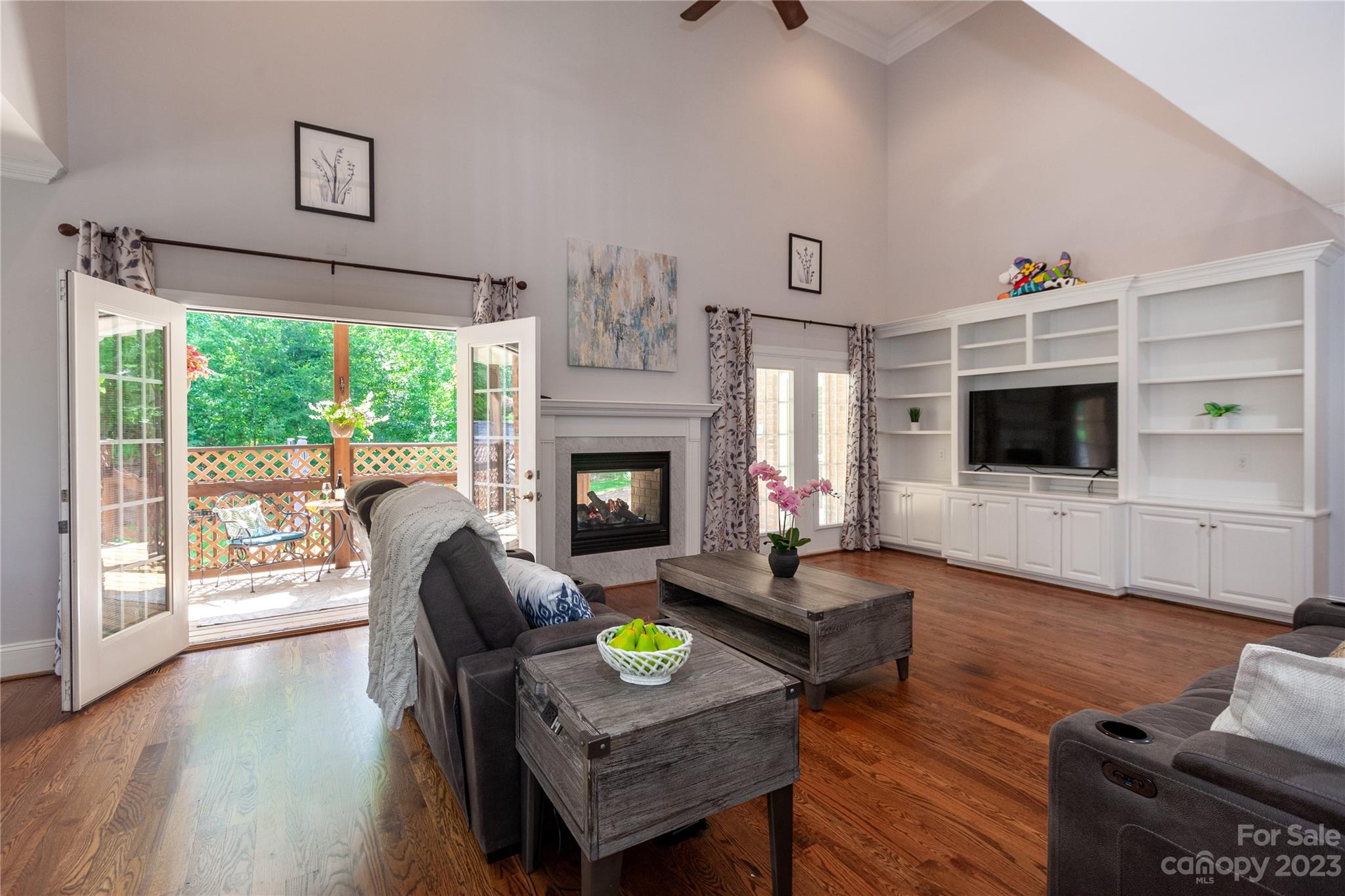 4058 Halyard Drive Denver, NC 28037 - Photo 17 of 46 a living room with furniture a flat screen tv and a fireplace