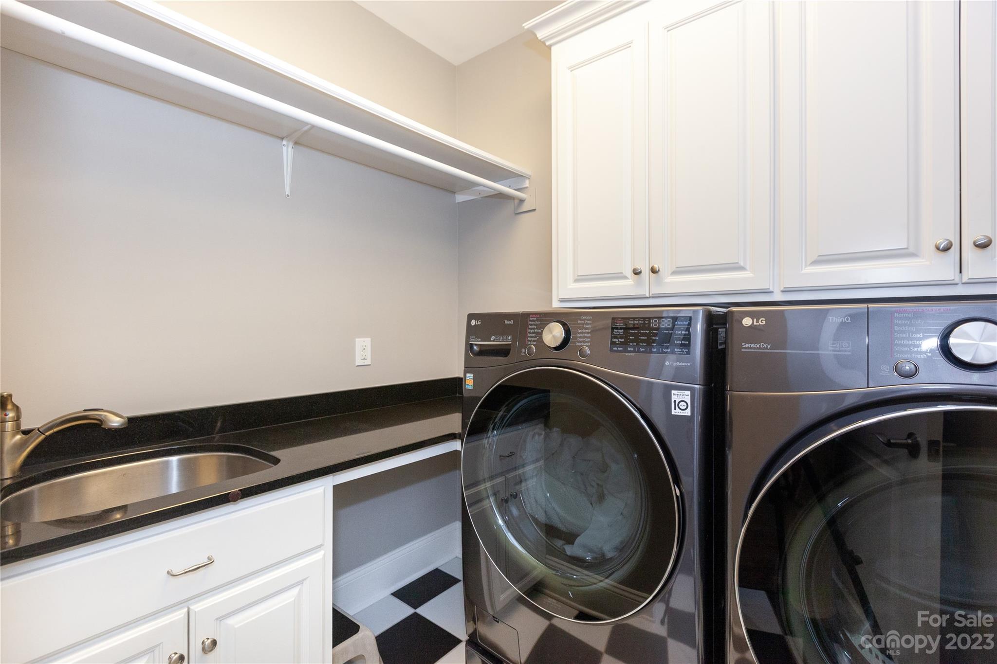 4058 Halyard Drive Denver, NC 28037 - Photo 18 of 46 a utility room with sink dryer and washer