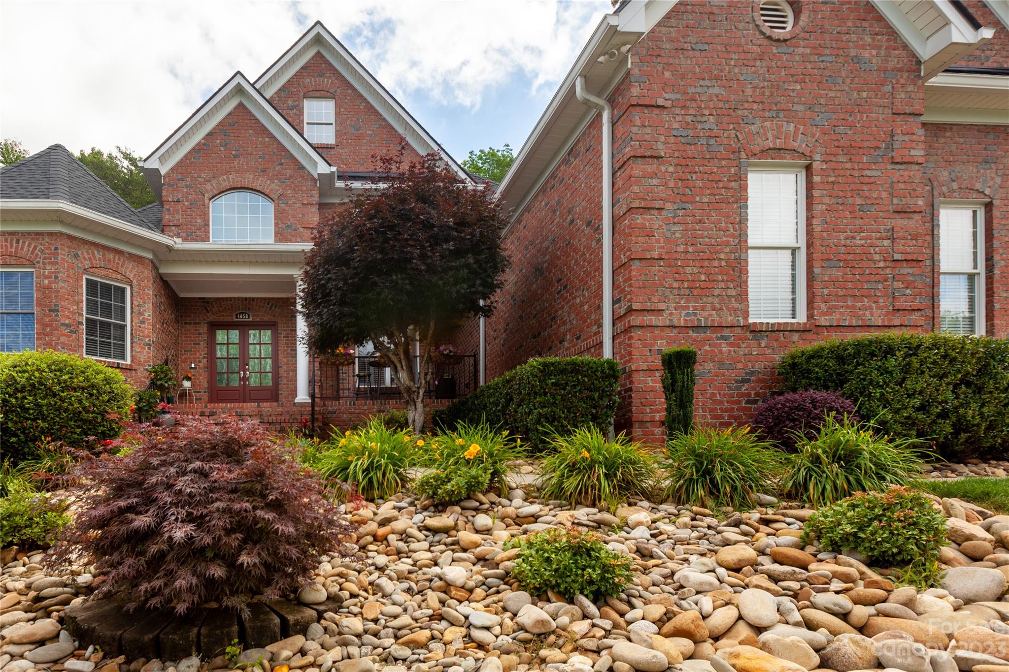 4058 Halyard Drive Denver, NC 28037 - Photo 2 of 46 a front view of a house with a yard