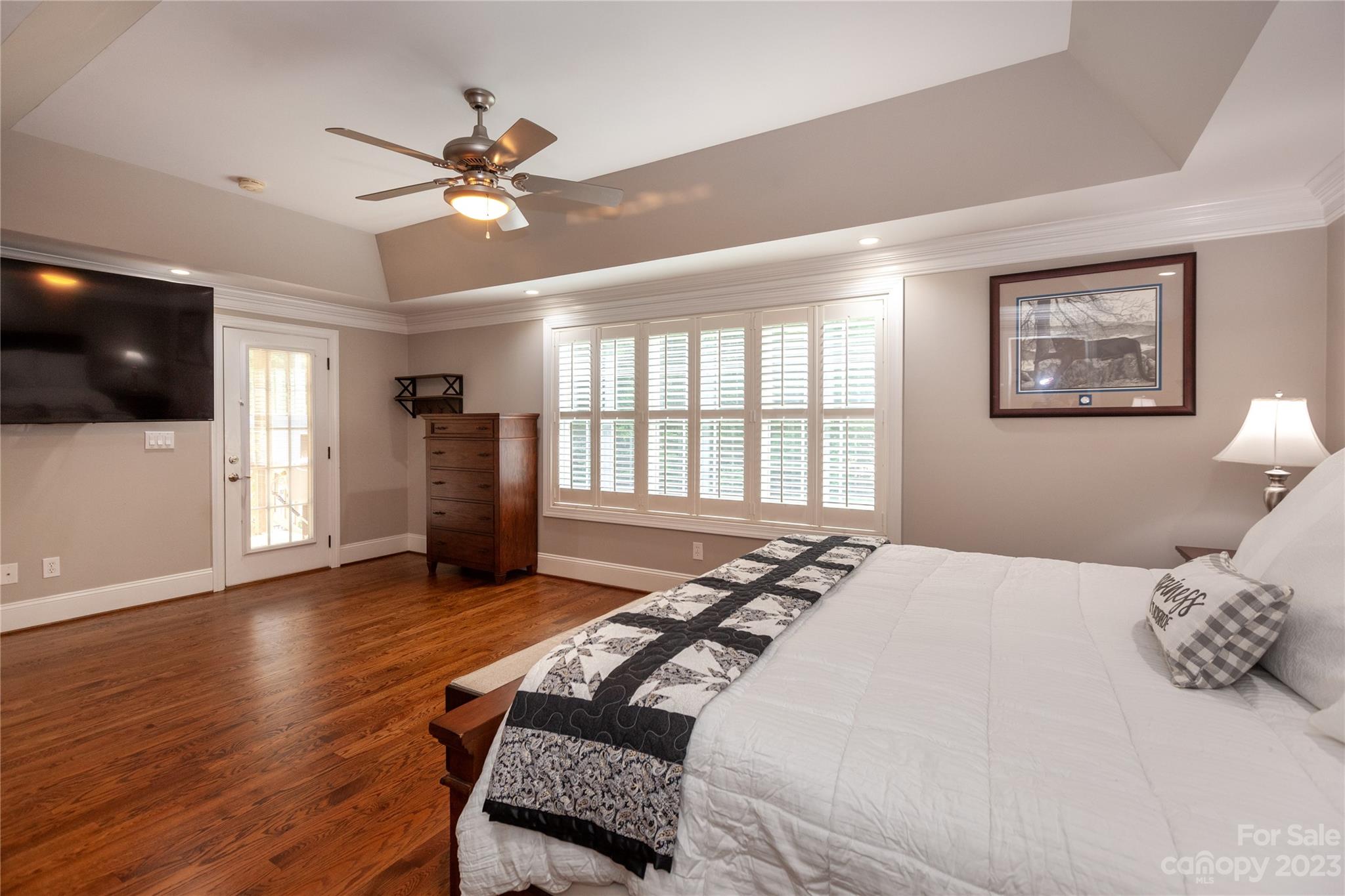 4058 Halyard Drive Denver, NC 28037 - Photo 23 of 46 a bedroom with a large bed and a flat screen tv