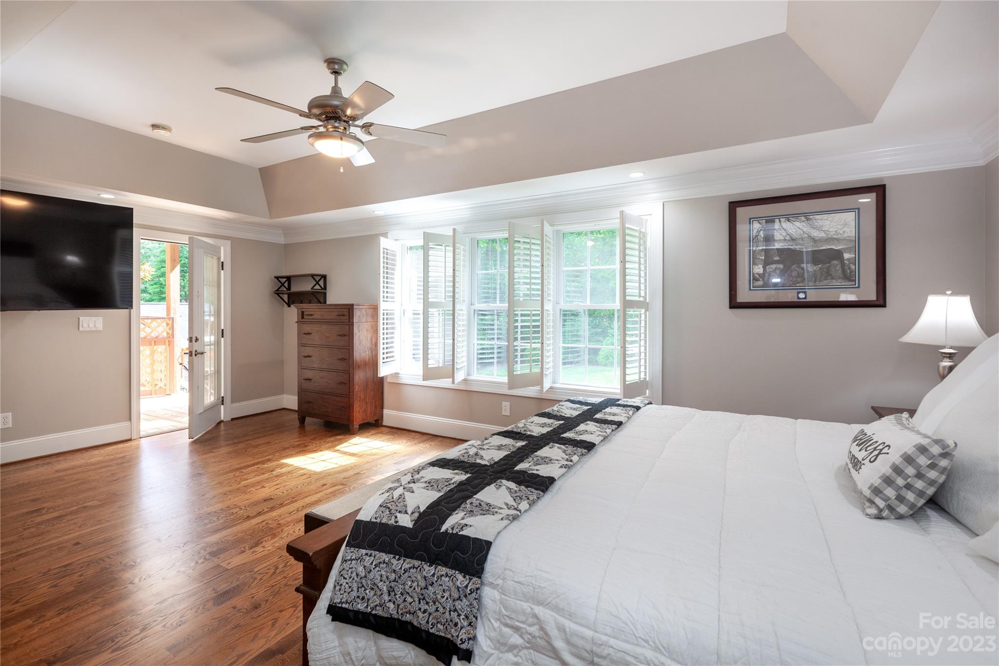 4058 Halyard Drive Denver, NC 28037 - Photo 24 of 46 a bedroom with a bed and a flat screen tv