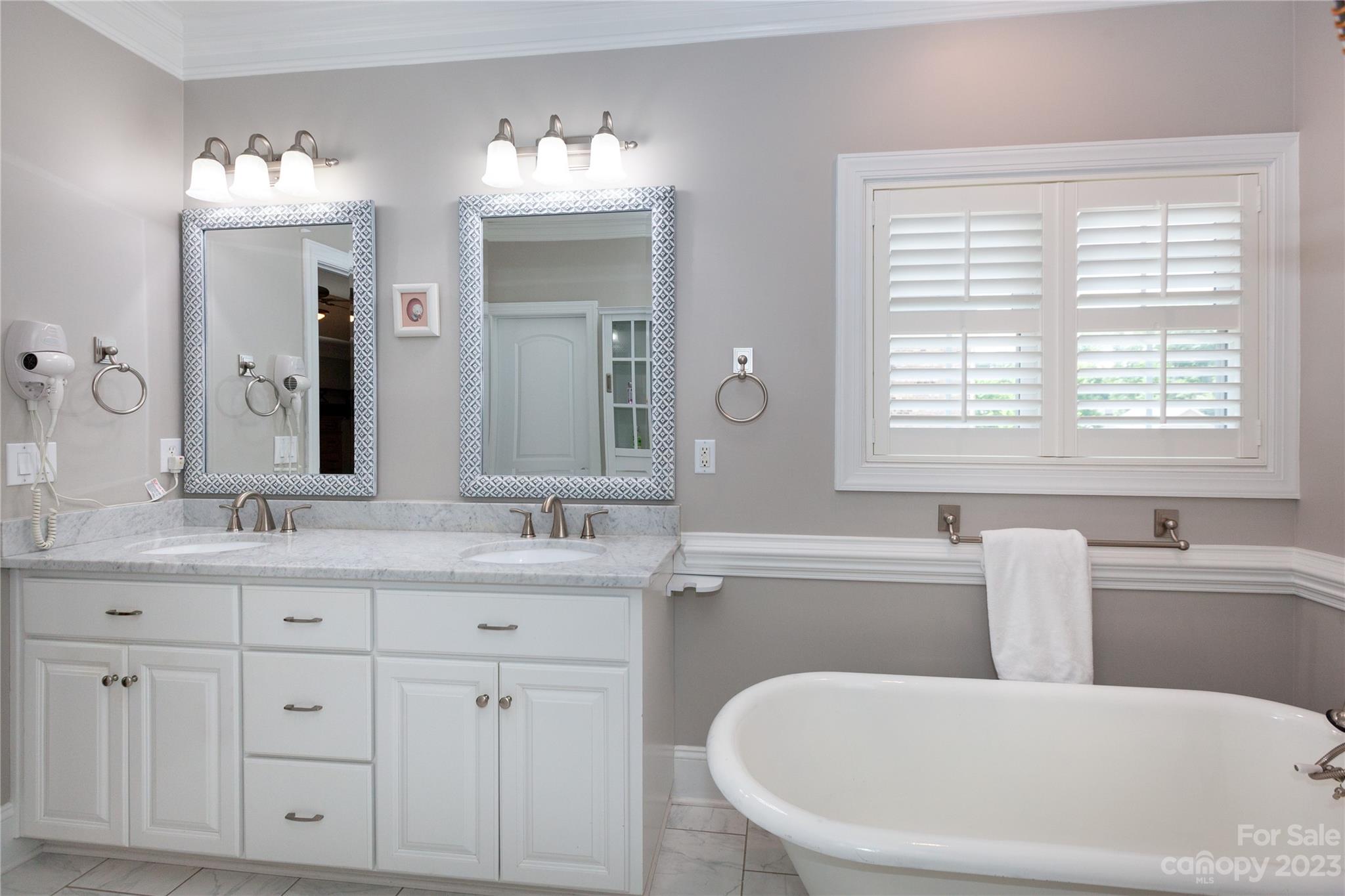 4058 Halyard Drive Denver, NC 28037 - Photo 26 of 46 a bathroom with a granite countertop sink tub and mirror