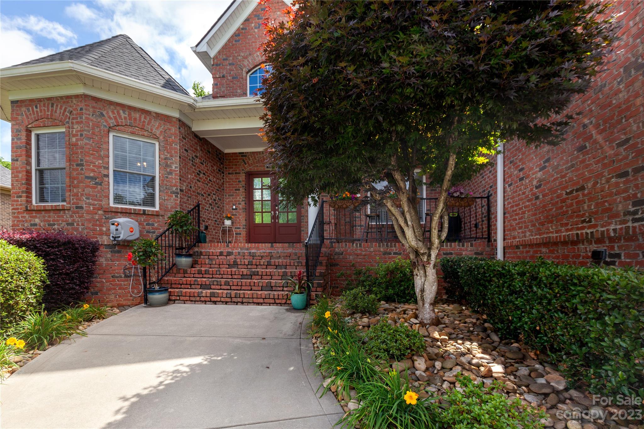4058 Halyard Drive Denver, NC 28037 - Photo 3 of 46 a front view of a house with trees