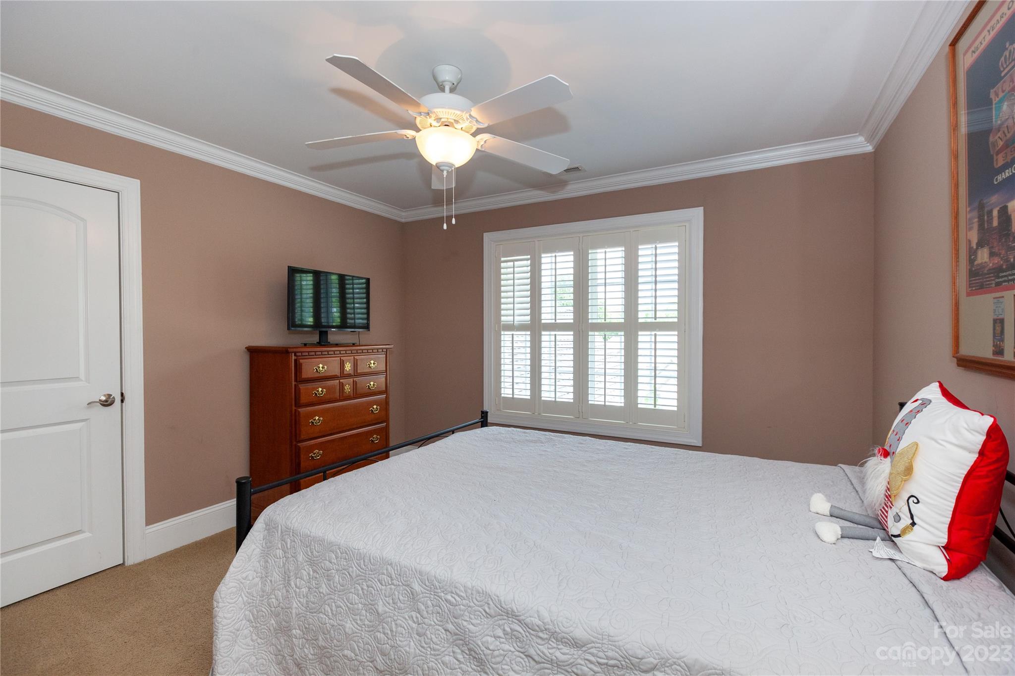 4058 Halyard Drive Denver, NC 28037 - Photo 39 of 46 a bedroom with a bed and a chandelier