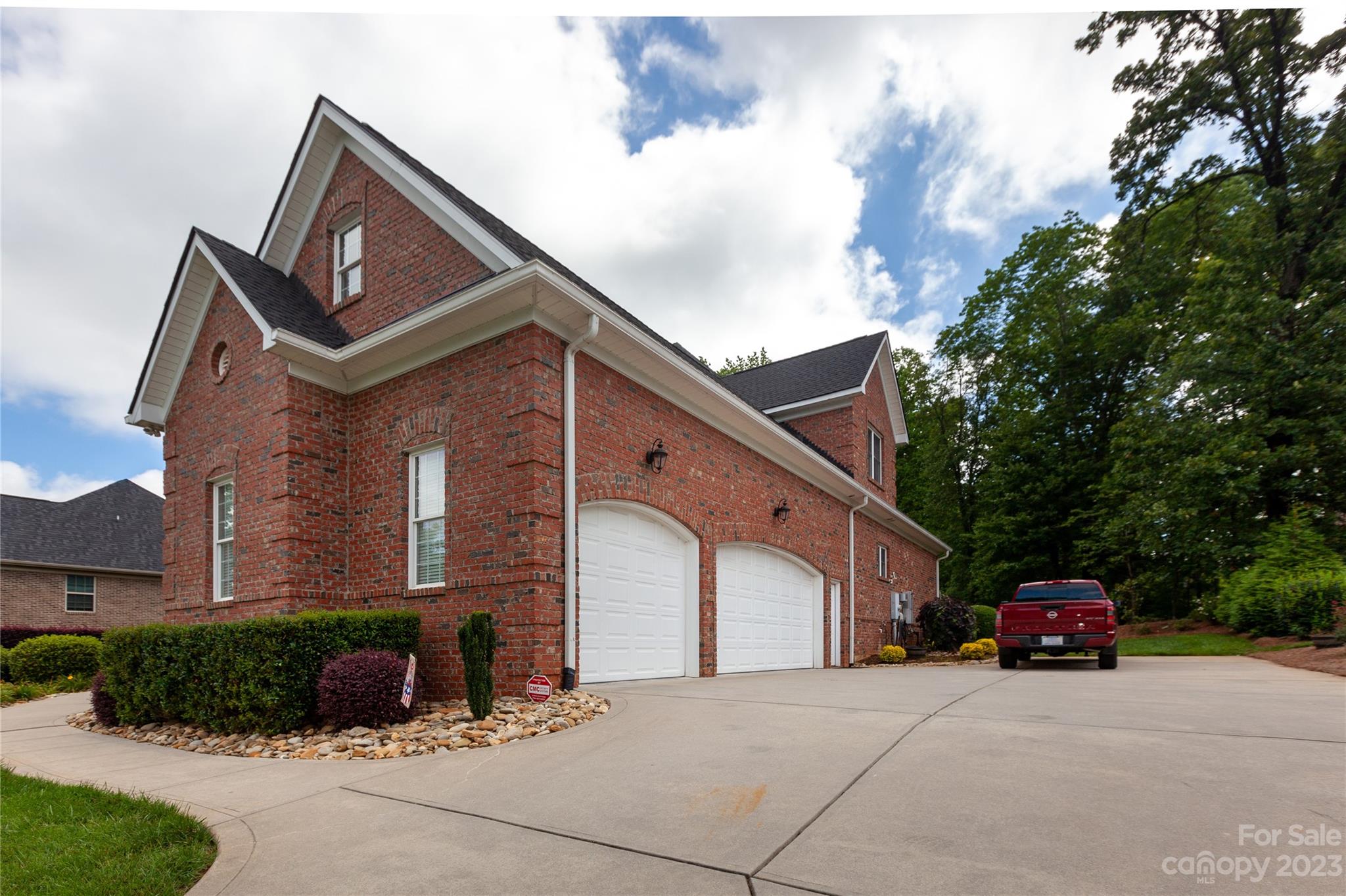 4058 Halyard Drive Denver, NC 28037 - Photo 4 of 46 a front view of a house with a yard and garage