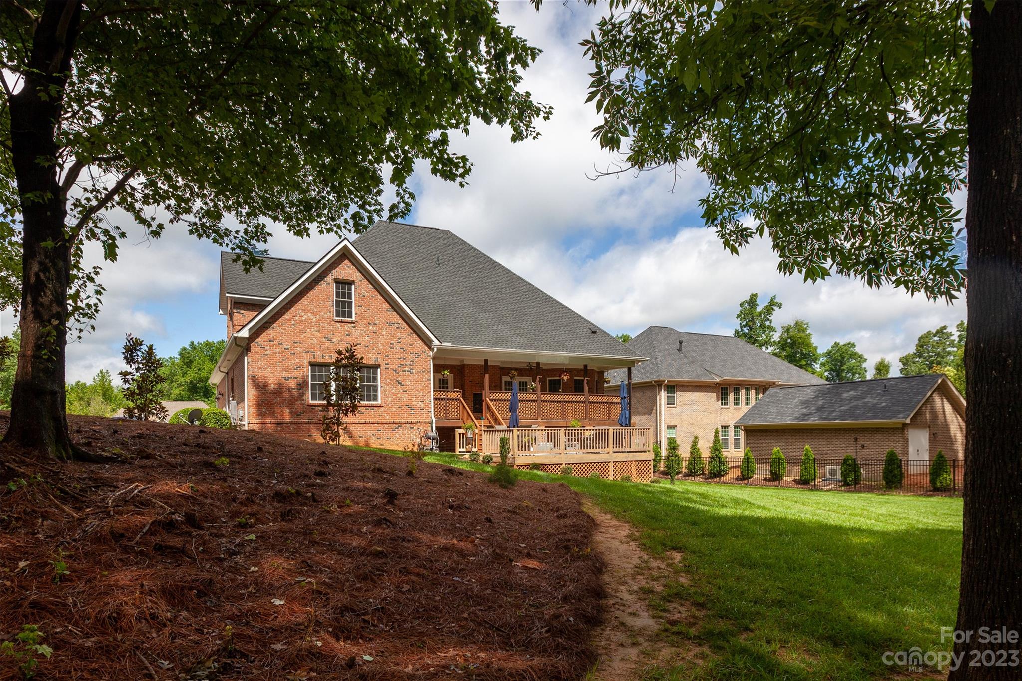 4058 Halyard Drive Denver, NC 28037 - Photo 45 of 46 a view of a yard in front of a house with large trees