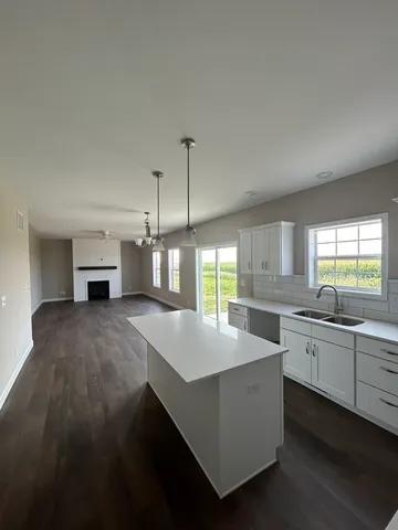 a kitchen with sink cabinets and window