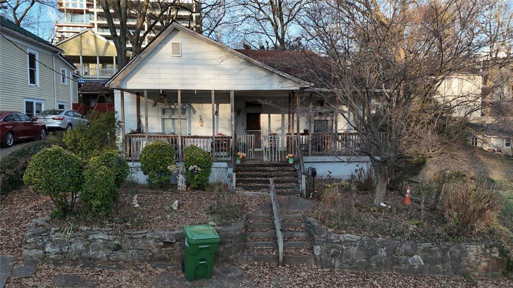 1052 Curran Street Northwest Atlanta, GA 30318 - Photo 3 of 13 a front view of a house with garden