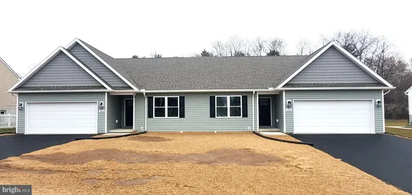 a front view of a house with yard