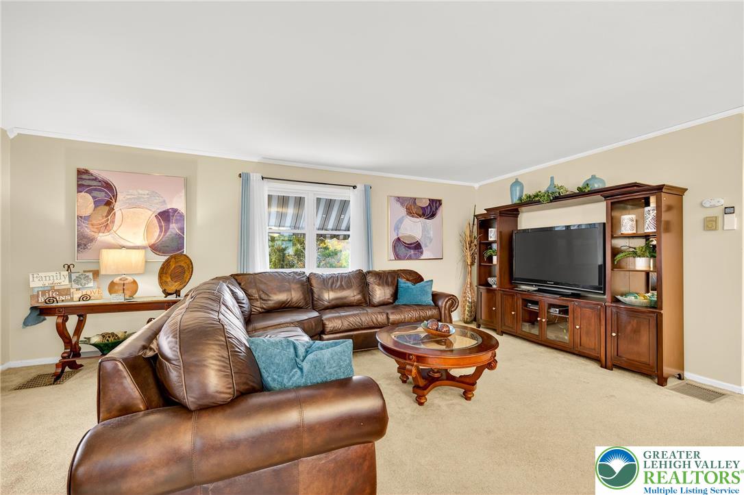 849 Weil Street Bethlehem, PA 18015 - Photo 13 of 58 a living room with furniture and a flat screen tv