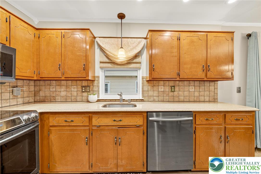 849 Weil Street Bethlehem, PA 18015 - Photo 21 of 58 a kitchen with a sink a stove and cabinets