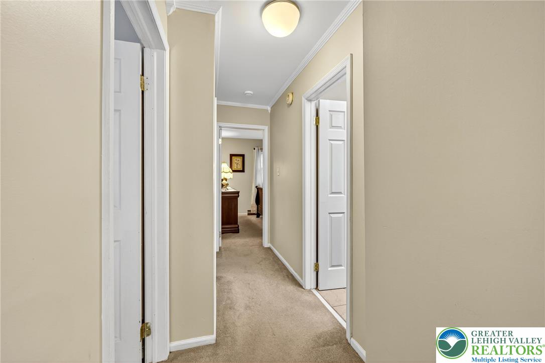 849 Weil Street Bethlehem, PA 18015 - Photo 24 of 58 a view of a hallway with wooden floor and a bathroom