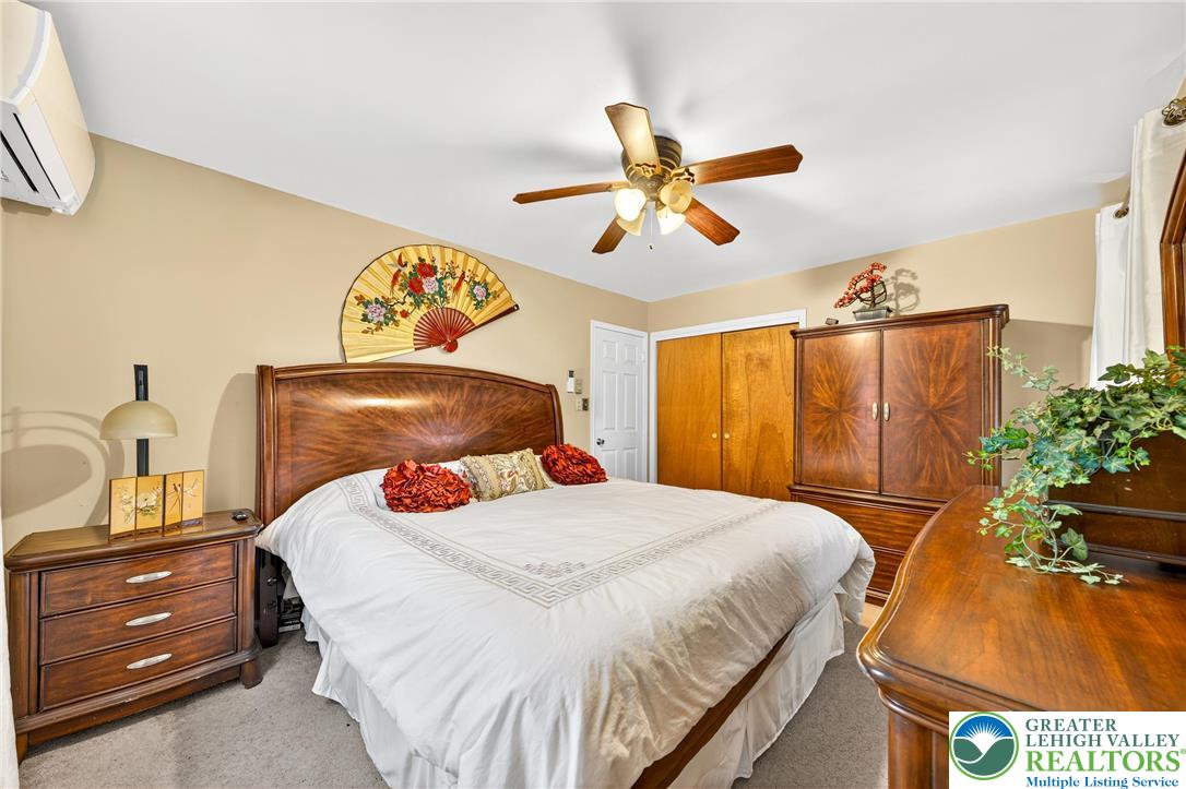 849 Weil Street Bethlehem, PA 18015 - Photo 29 of 58 a bedroom with a bed and a chandelier