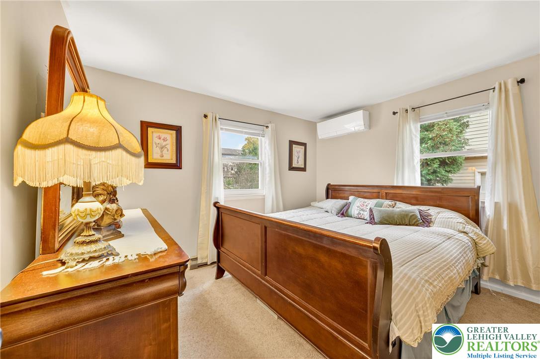 849 Weil Street Bethlehem, PA 18015 - Photo 33 of 58 a bedroom with a bed and wooden floor