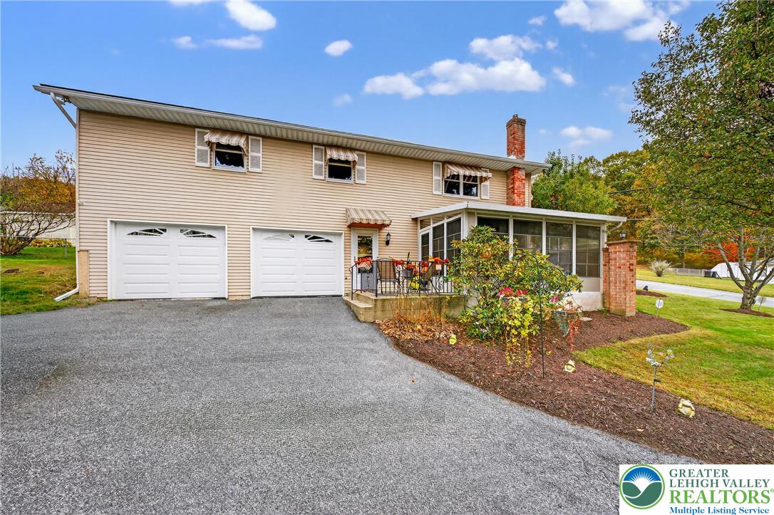 849 Weil Street Bethlehem, PA 18015 - Photo 4 of 58 a front view of house with a yard and garage