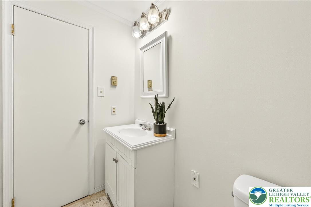 849 Weil Street Bethlehem, PA 18015 - Photo 42 of 58 a bathroom with a sink a mirror and a shower