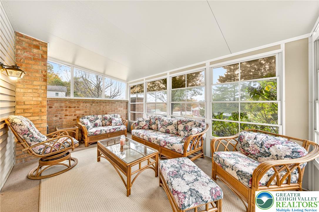 849 Weil Street Bethlehem, PA 18015 - Photo 44 of 58 a living room with furniture and a floor to ceiling window