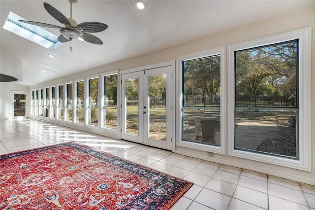 a view of a hallway with windows