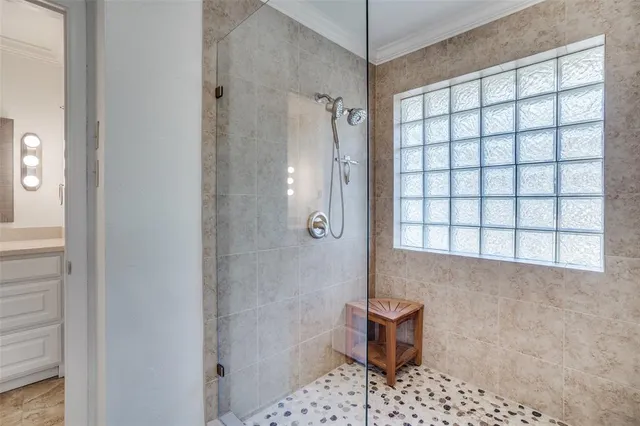 a bathroom with a shower toilet and sink