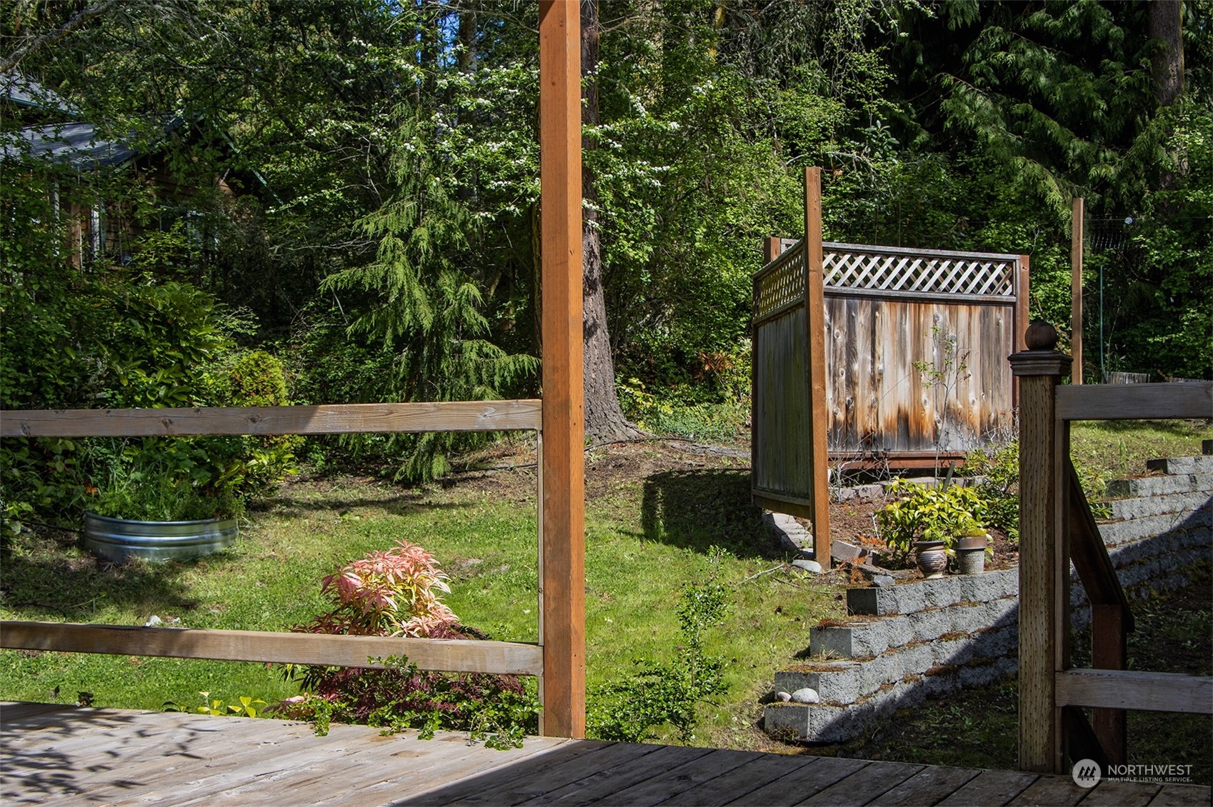 5291 Cape George Road Port Townsend, WA 98368 - Photo 15 of 25 a view of a garden from a bench