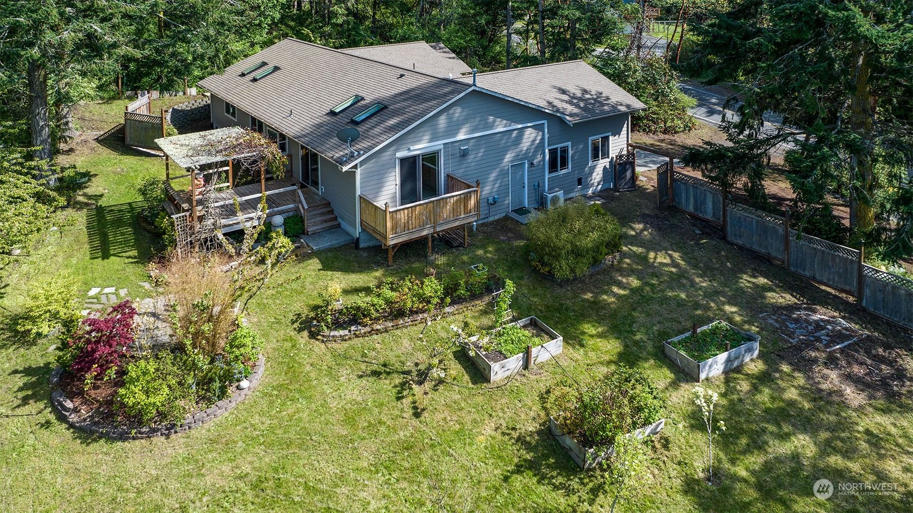 5291 Cape George Road Port Townsend, WA 98368 - Photo 20 of 25 an aerial view of a house with a yard potted plants and large tree