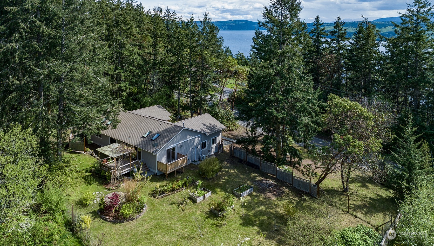 5291 Cape George Road Port Townsend, WA 98368 - Photo 2 of 25 an aerial view of a house with yard and outdoor seating