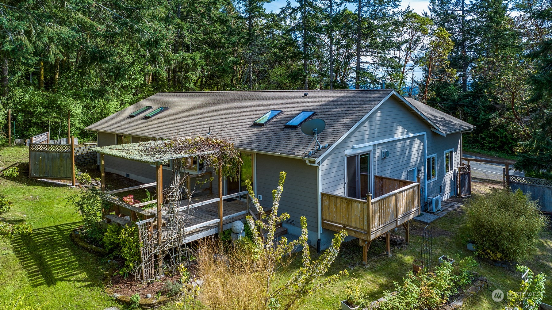 5291 Cape George Road Port Townsend, WA 98368 - Photo 3 of 25 an aerial view of a house with swimming pool next to a yard