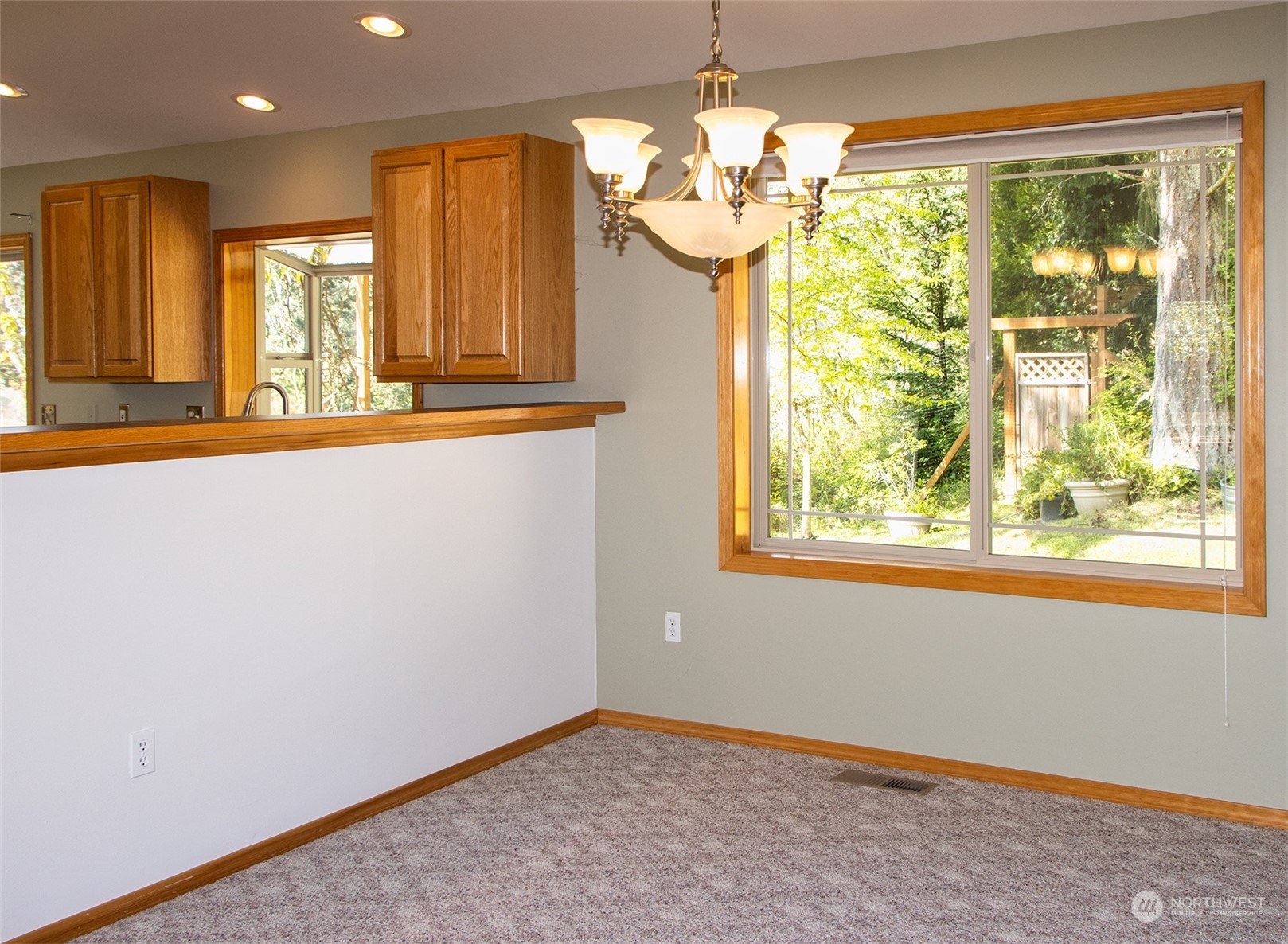 5291 Cape George Road Port Townsend, WA 98368 - Photo 9 of 25 a view of a room with a large window and chandelier
