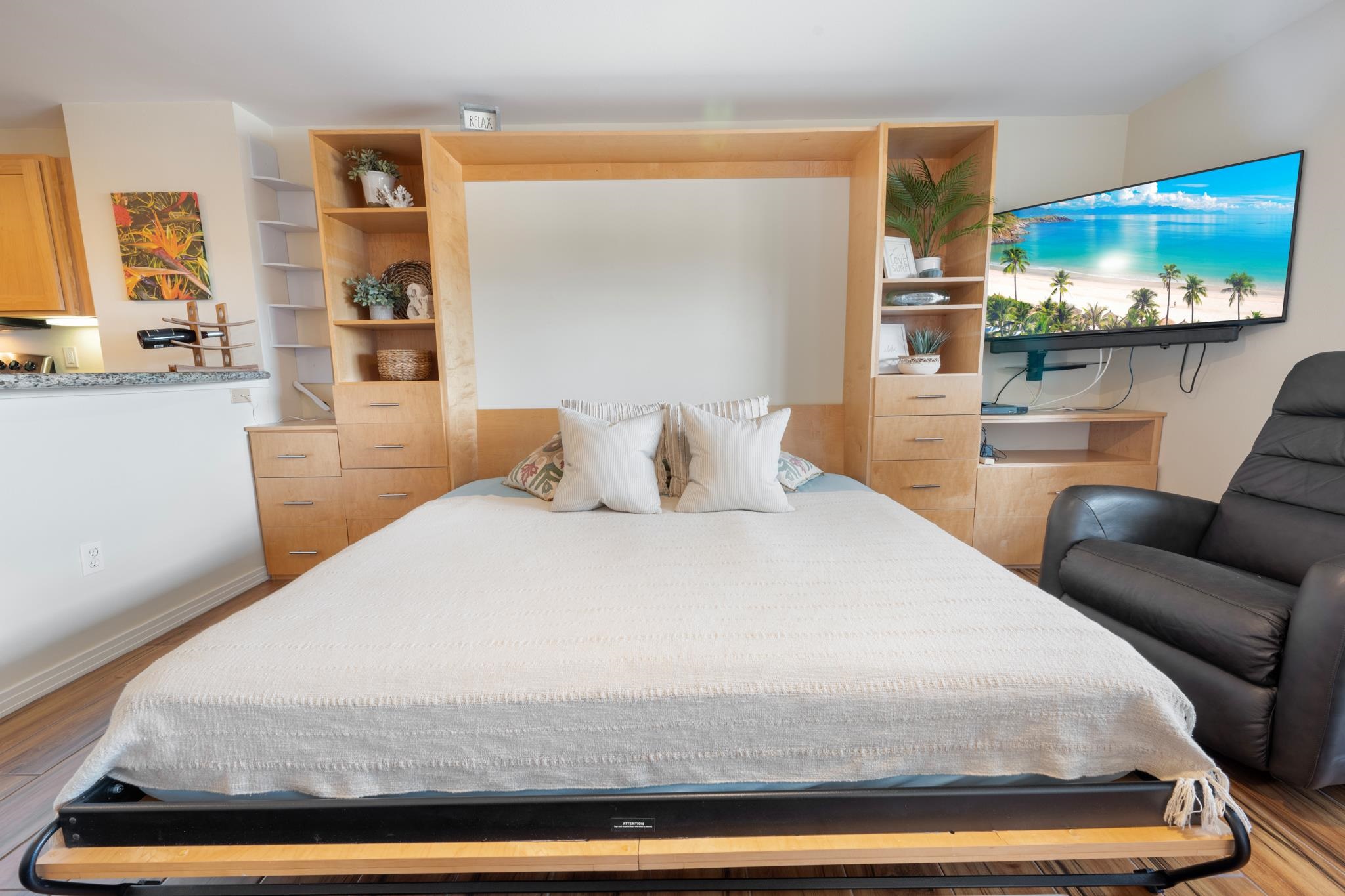 3708 Lower Honoapiilani Road, Unit E41 Lahaina, HI 96761 - Photo 12 of 42 a bedroom with a bed and glass wall