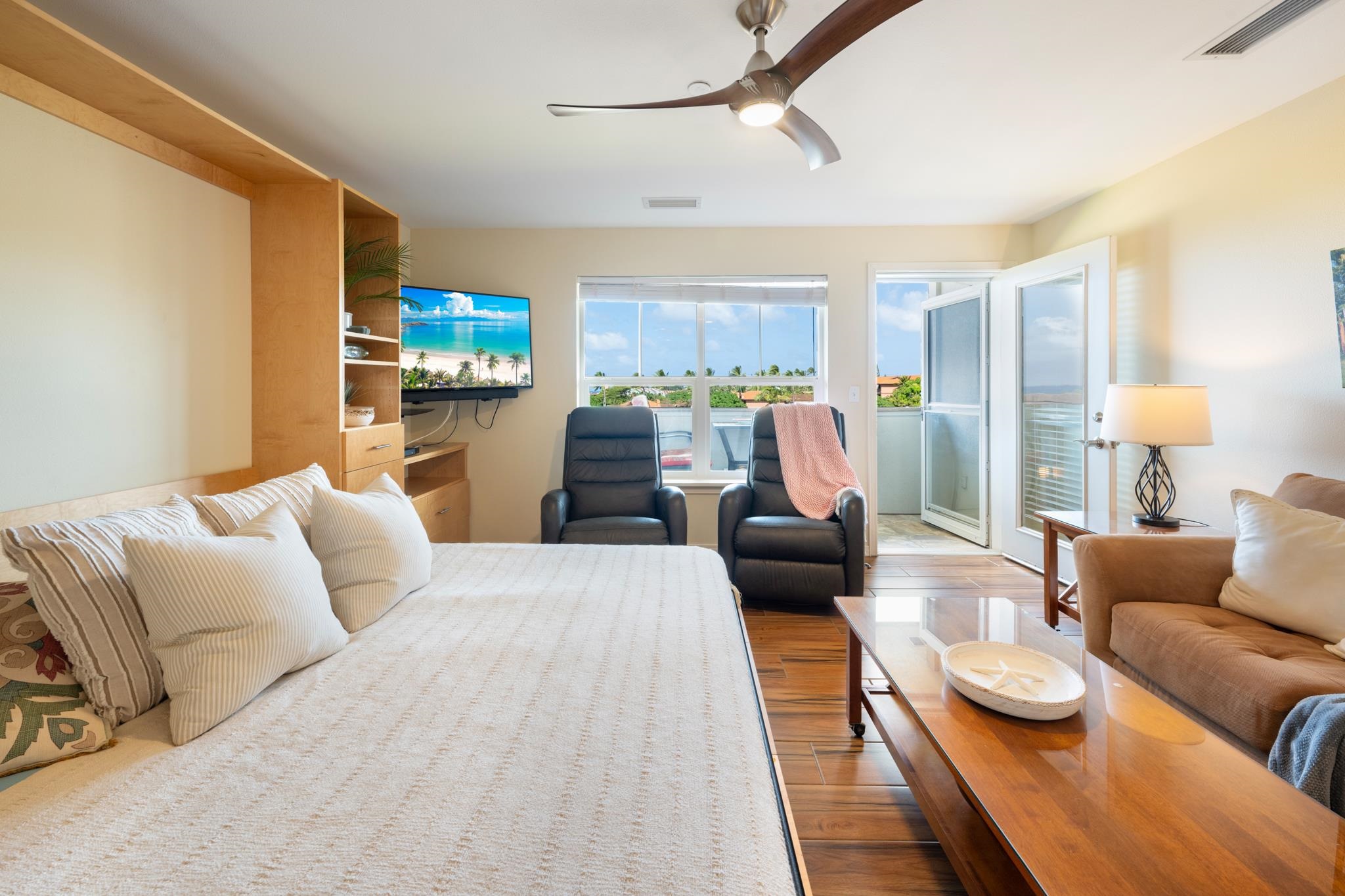 3708 Lower Honoapiilani Road, Unit E41 Lahaina, HI 96761 - Photo 2 of 42 a living room with furniture and a flat screen tv