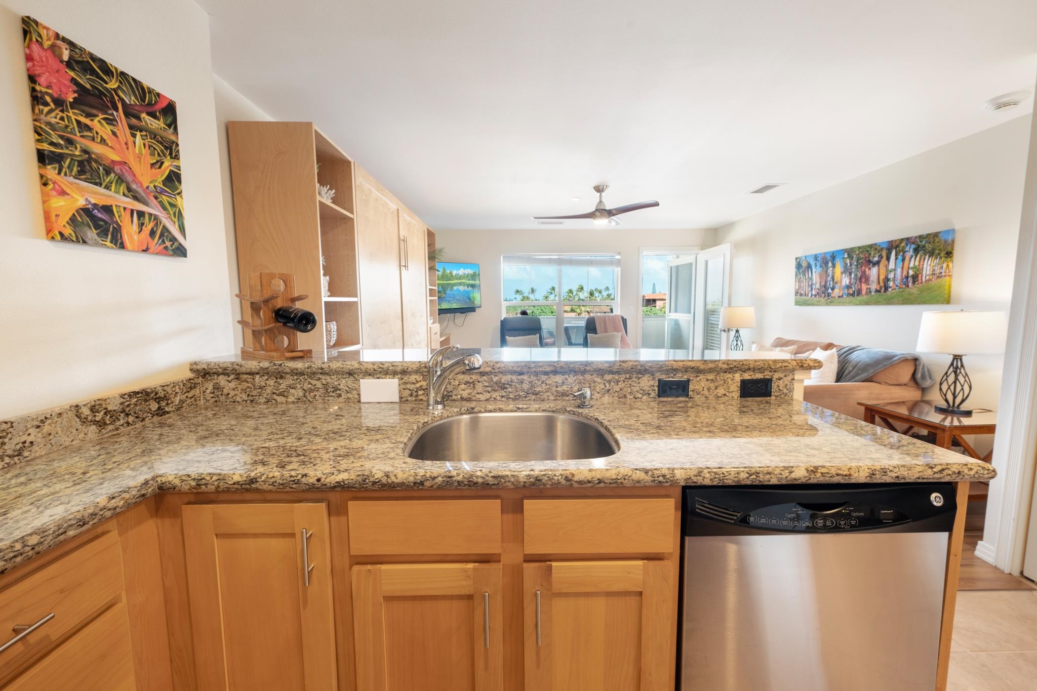 3708 Lower Honoapiilani Road, Unit E41 Lahaina, HI 96761 - Photo 21 of 42 a kitchen with stainless steel appliances granite countertop a sink and a granite counter tops
