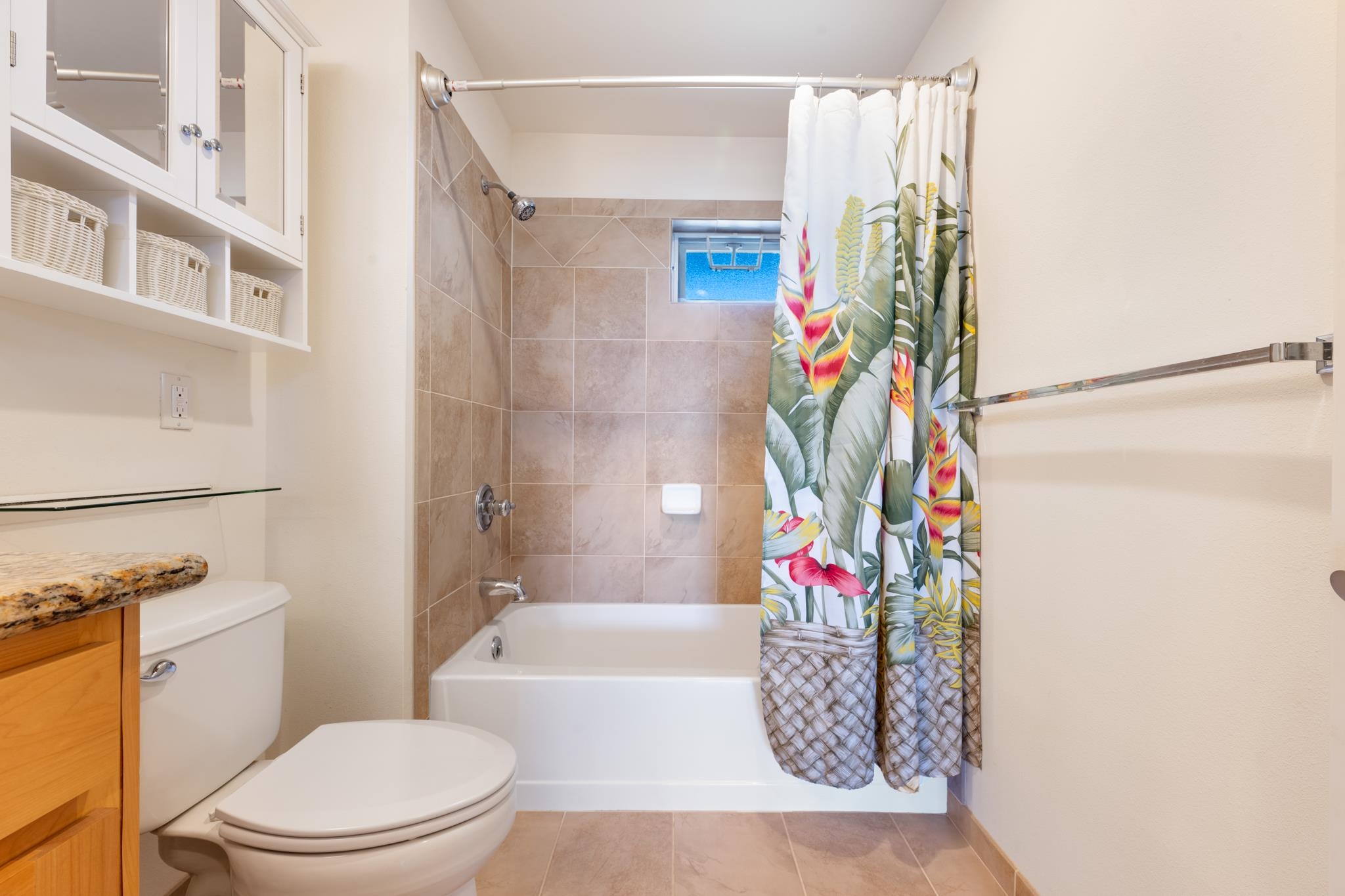 3708 Lower Honoapiilani Road, Unit E41 Lahaina, HI 96761 - Photo 24 of 42 a bathroom with a toilet and a shower curtain