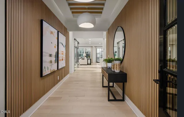 a view of a patio with a dining table and chairs with a small yard
