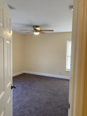 an empty room with a wooden door