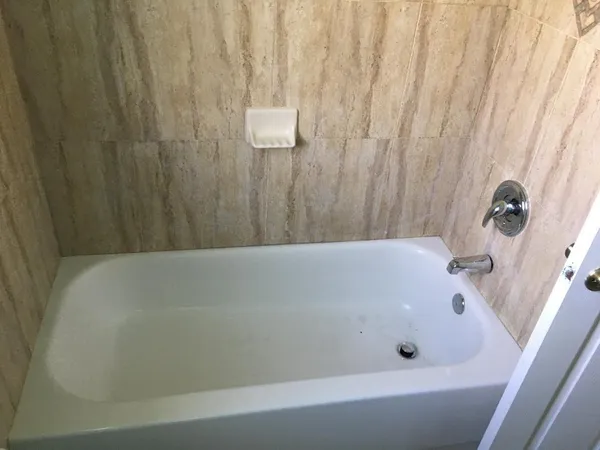 a bathroom with a sink and a window