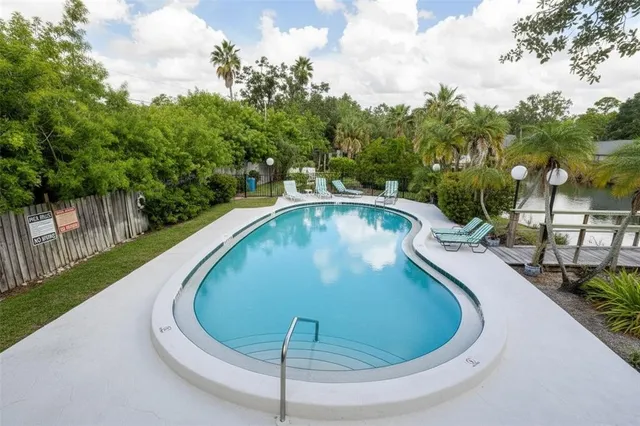a view of a swimming pool with a balcony