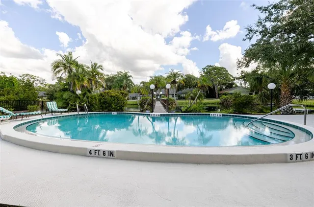 a view of a water fountain with a lake view
