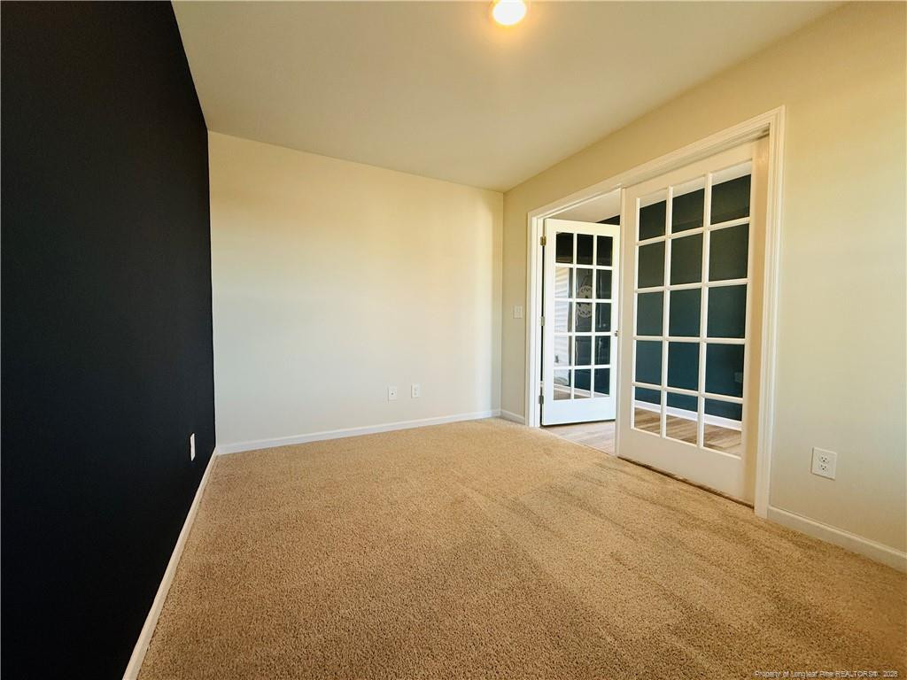 4029 Racking Horse Road Hope Mills, NC 28306 - Photo 7 of 30 a view of an empty room with a window
