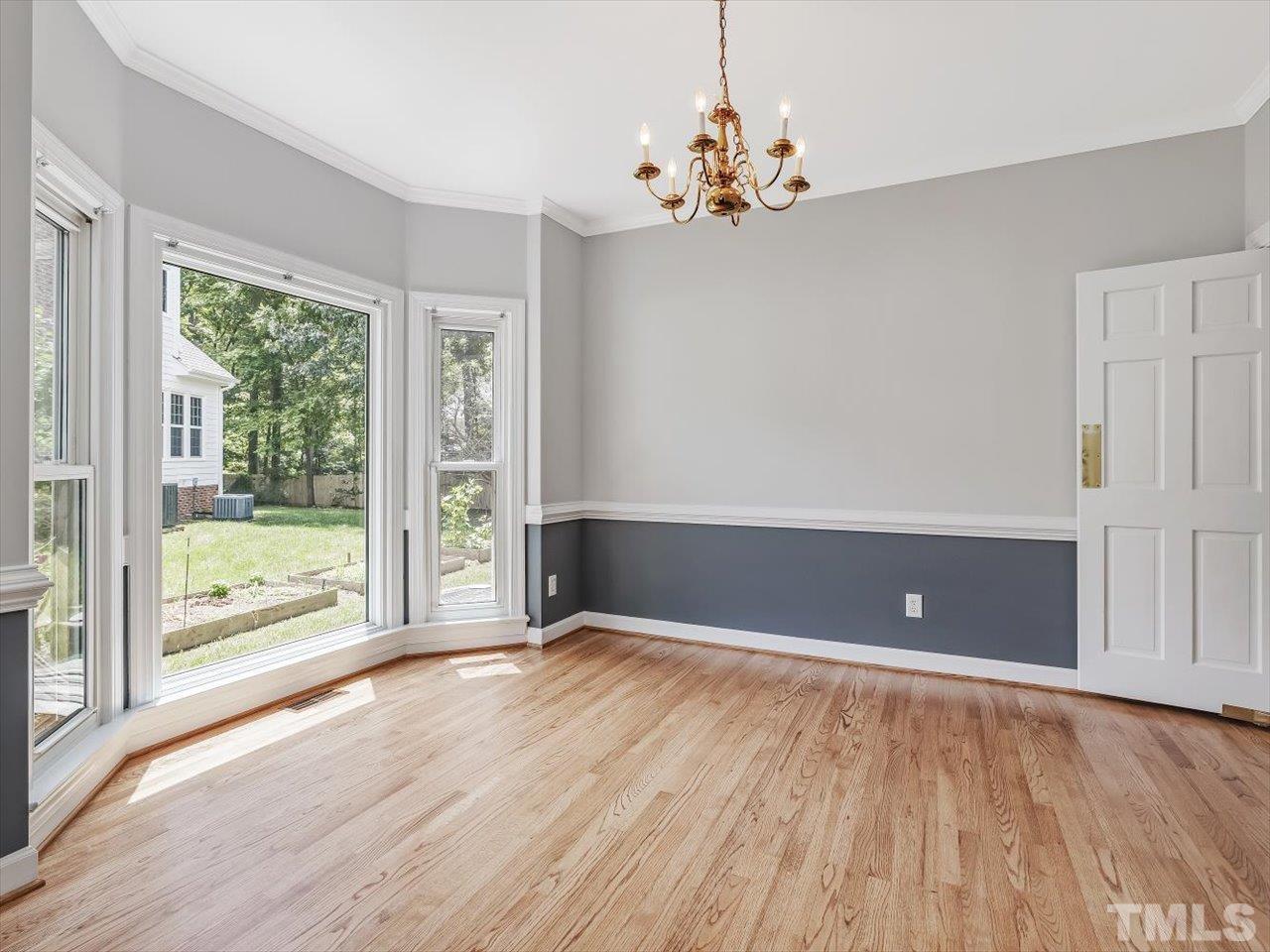 4 Caspian Court Durham, NC 27713 - Photo 13 of 84 a view of an empty room with wooden floor and a window