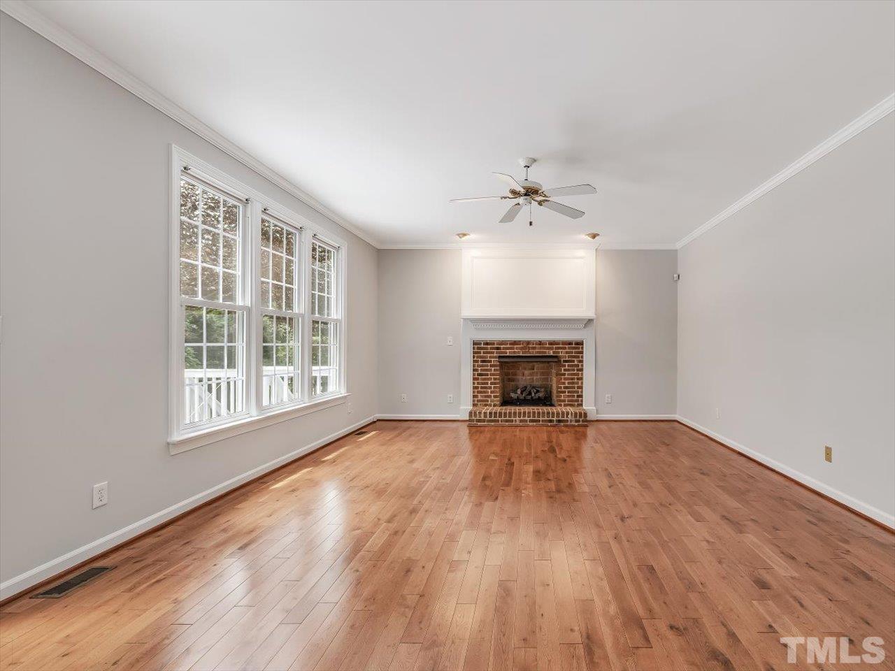 4 Caspian Court Durham, NC 27713 - Photo 20 of 84 a view of an empty room with wooden floor and a window