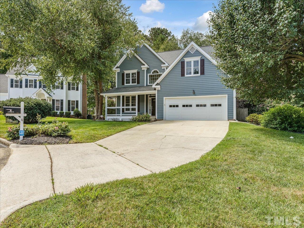 4 Caspian Court Durham, NC 27713 - Photo 2 of 84 a front view of a house with a yard and potted plants