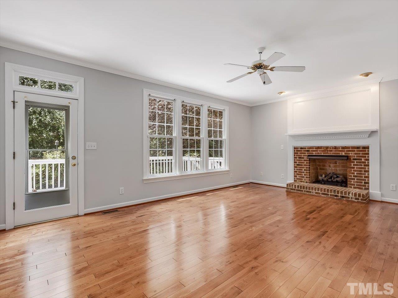 4 Caspian Court Durham, NC 27713 - Photo 22 of 84 a view of an empty room with exposed radiator and fireplace