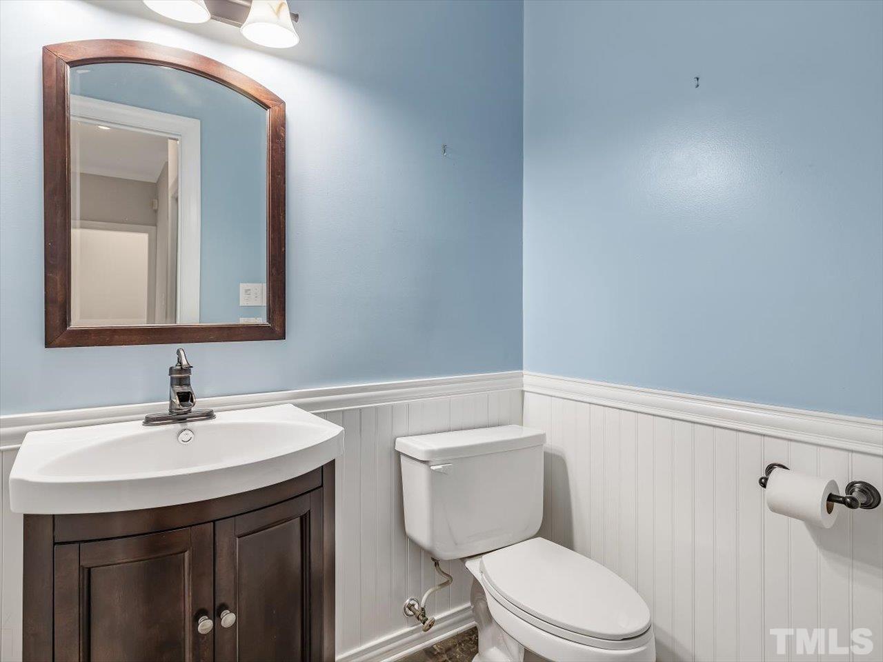 4 Caspian Court Durham, NC 27713 - Photo 28 of 84 a bathroom with a toilet a sink and mirror