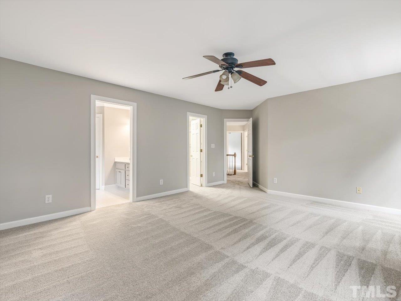 4 Caspian Court Durham, NC 27713 - Photo 32 of 84 a view of a livingroom with a ceiling fan and window