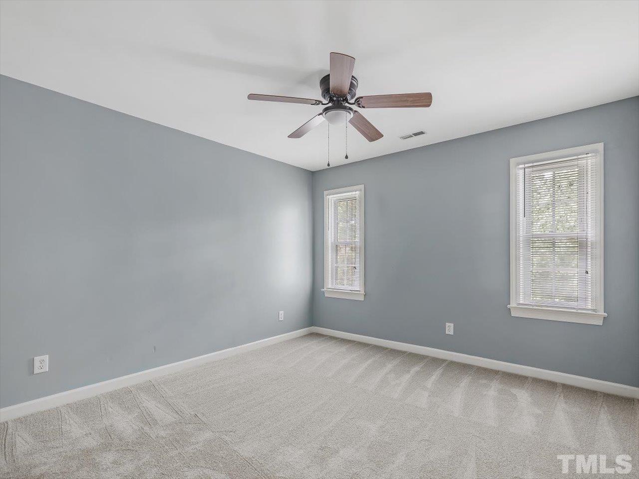 4 Caspian Court Durham, NC 27713 - Photo 38 of 84 an empty room with windows and fan