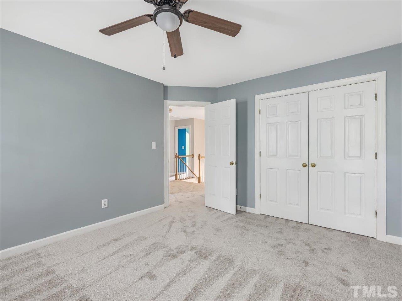 4 Caspian Court Durham, NC 27713 - Photo 39 of 84 a view of an empty room and chandelier fan