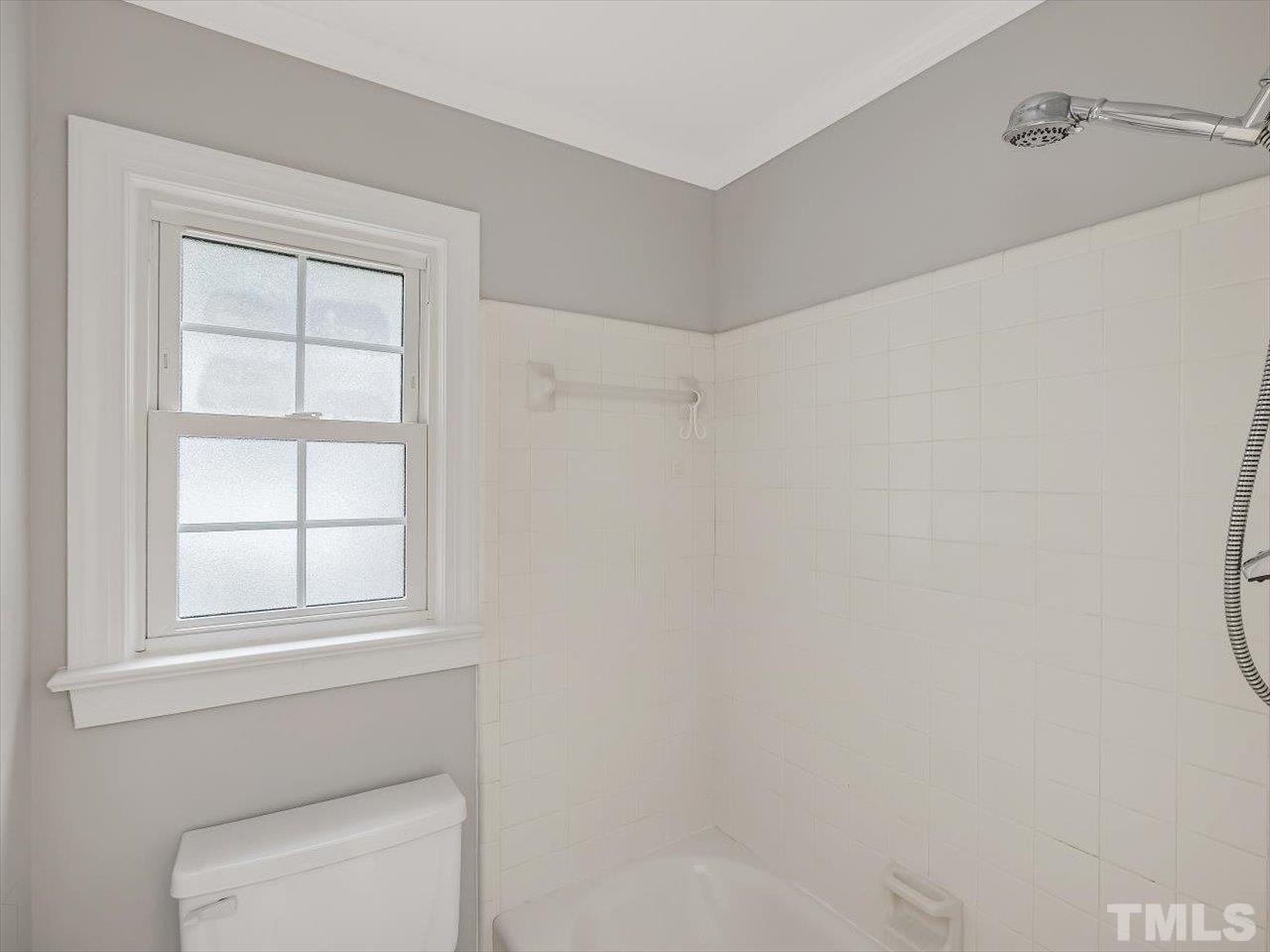 4 Caspian Court Durham, NC 27713 - Photo 41 of 84 a bathroom with a toilet a window and a shower