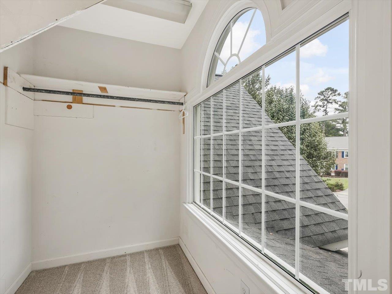 4 Caspian Court Durham, NC 27713 - Photo 44 of 84 a view of a balcony with a floor to ceiling window