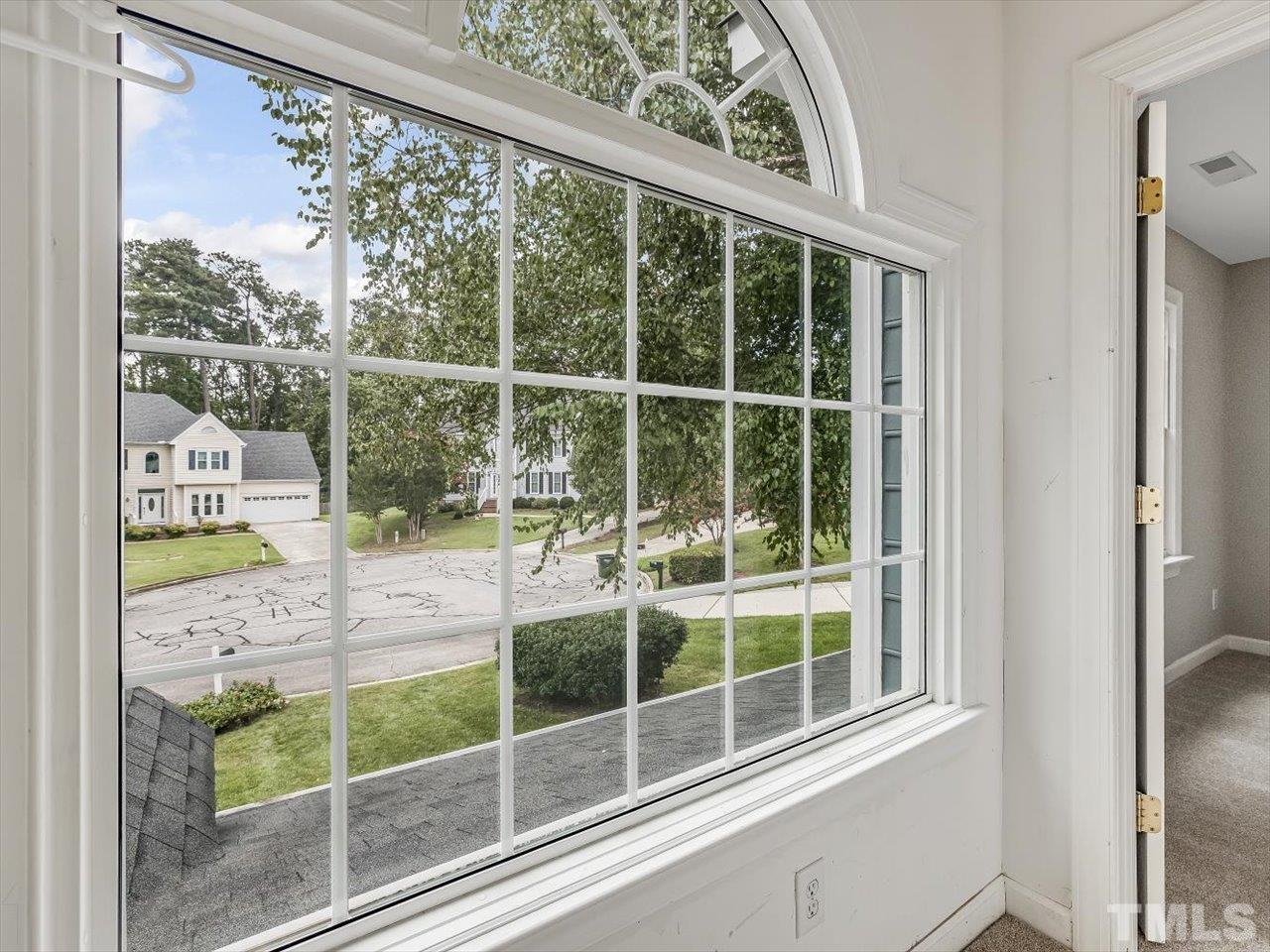 4 Caspian Court Durham, NC 27713 - Photo 45 of 84 a view of a room with a large window and wooden floor